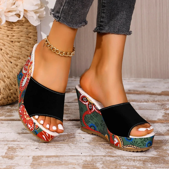 Joelle™ — Sculptural mules with a floral heel