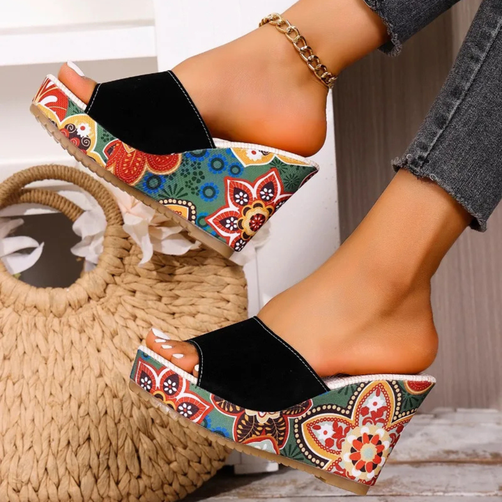 Joelle™ — Sculptural mules with a floral heel