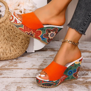 Joelle™ — Sculptural mules with a floral heel