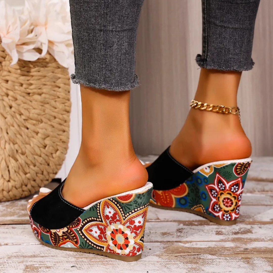 Joelle™ — Sculptural mules with a floral heel