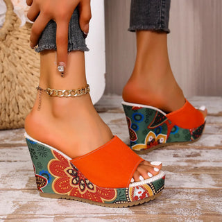 Joelle™ — Sculptural mules with a floral heel