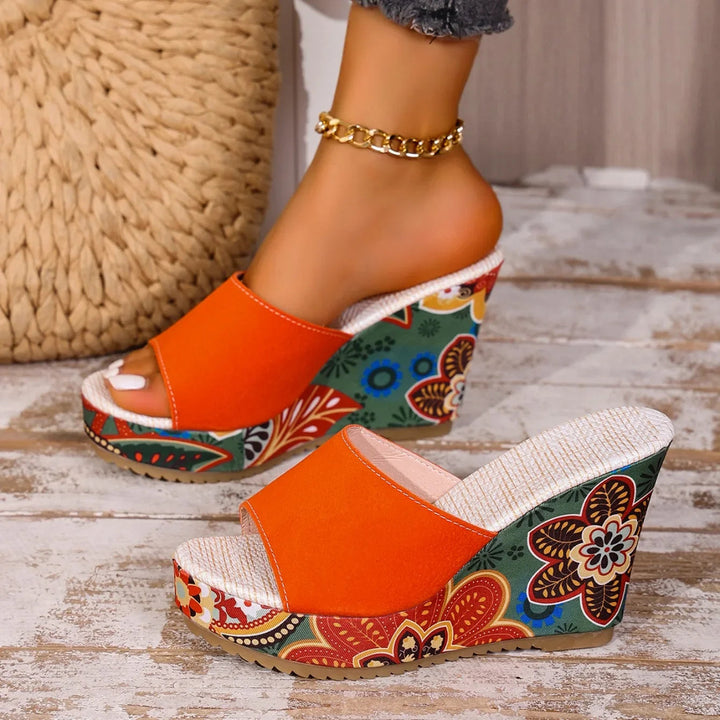 Joelle™ — Sculptural mules with a floral heel