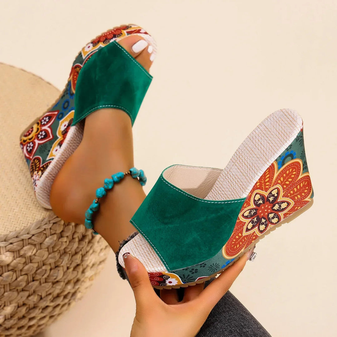 Joelle™ — Sculptural mules with a floral heel