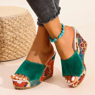 Joelle™ — Sculptural mules with a floral heel
