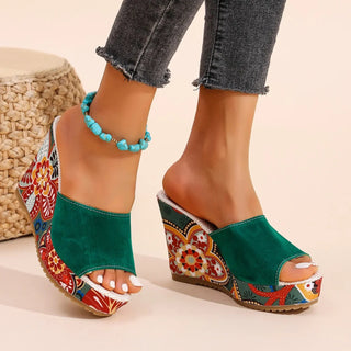 Joelle™ — Sculptural mules with a floral heel