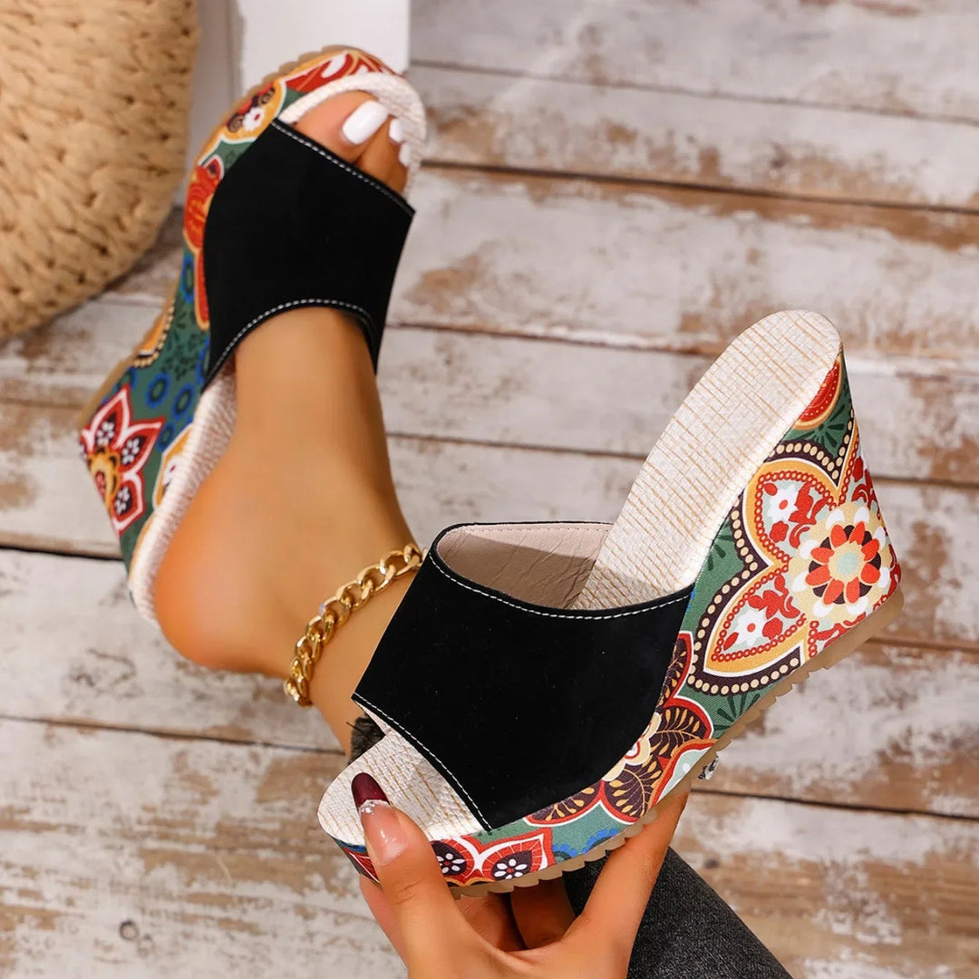 Joelle™ — Sculptural mules with a floral heel